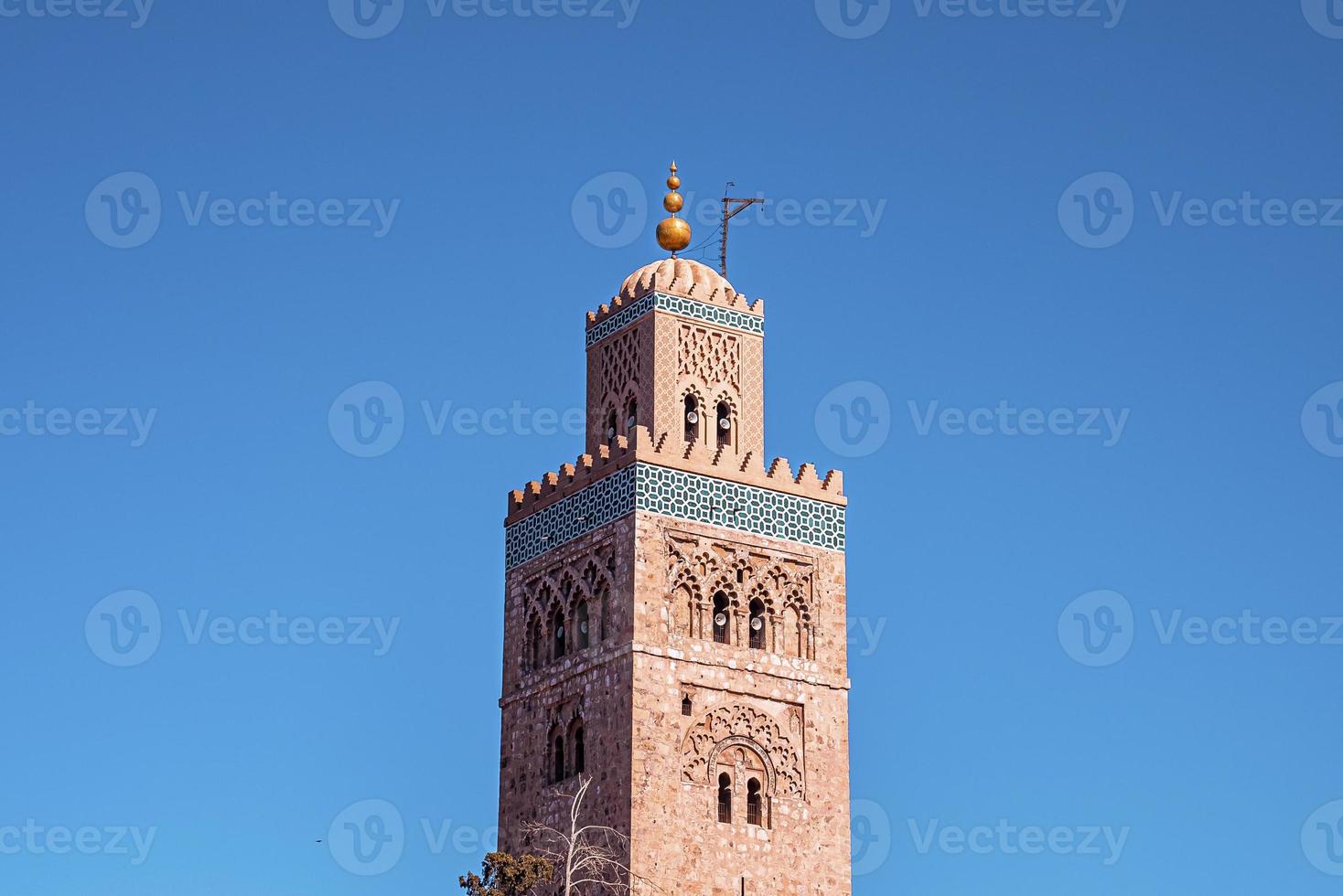 Koutoubia Mosque minaret an old historic arab tourist landmark in oriental Marrakech photo