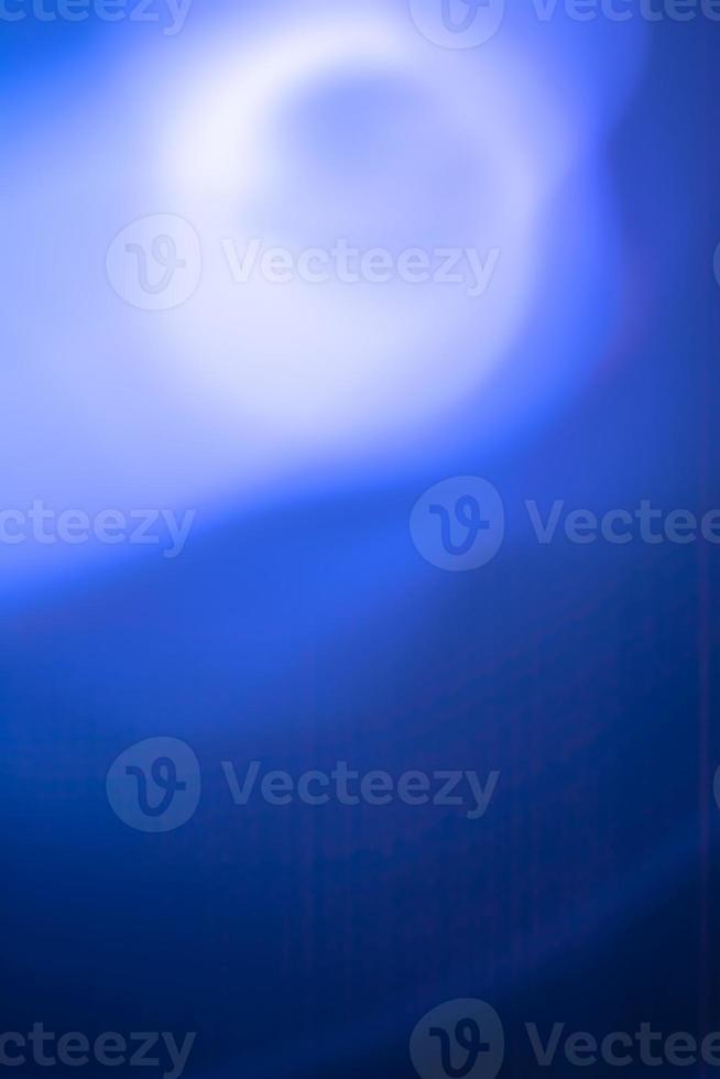 Vertical abstraction in blue tones, full moon in the fog. photo