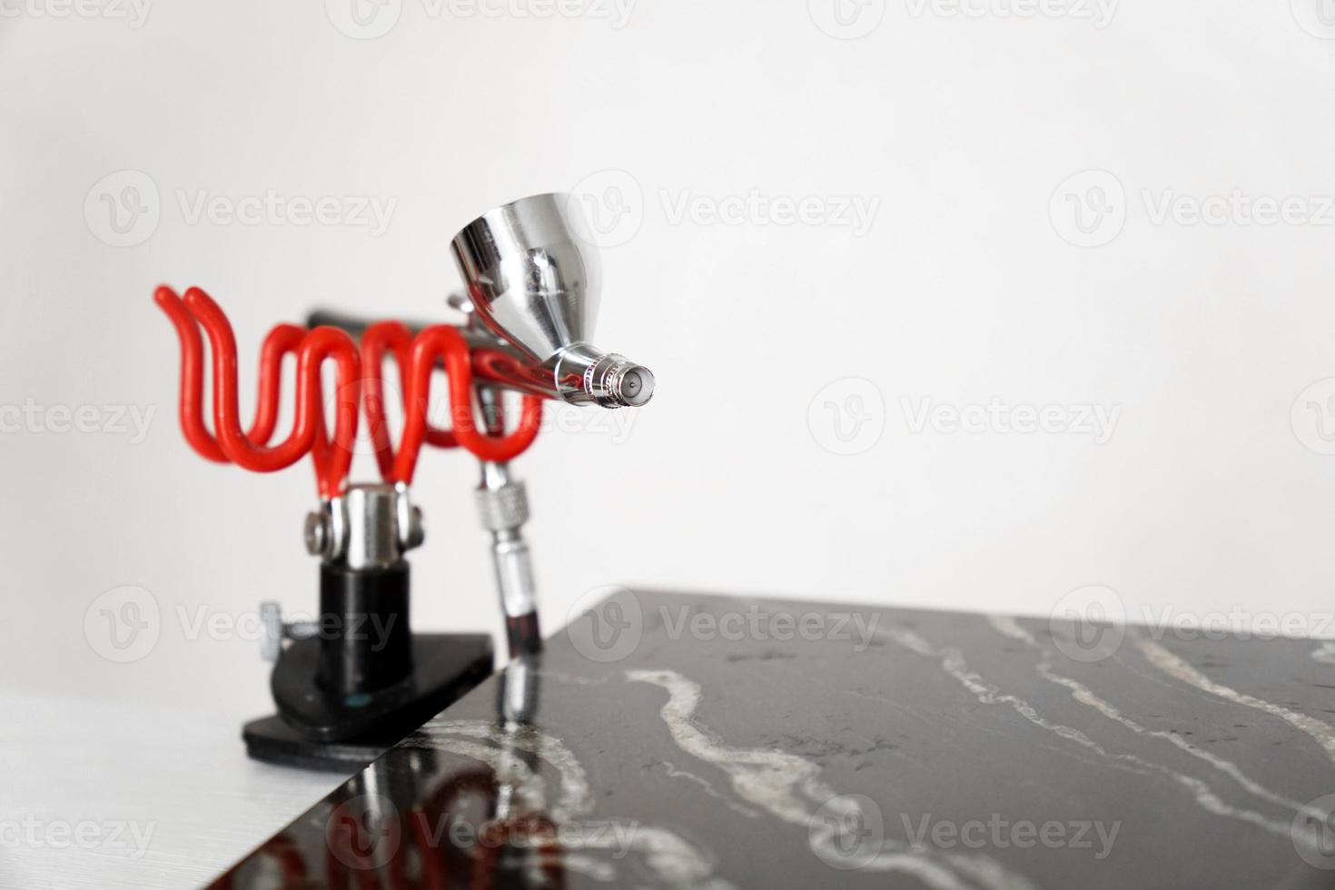 Close-up of a pastry airbrush on a blurred background photo