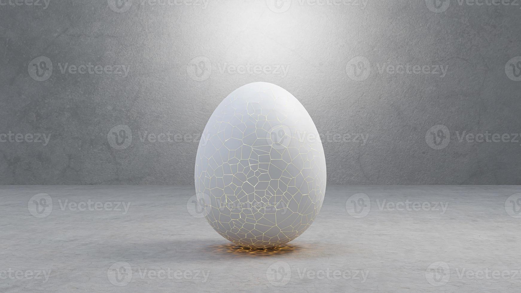 Cracked egg to hatching with light inside, on cement floor, and light shining from above. photo