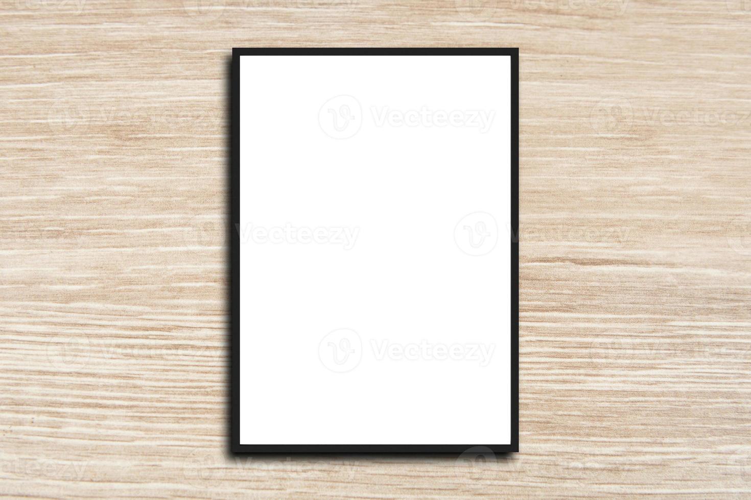 Mock up blank poster picture frame on wood wall photo