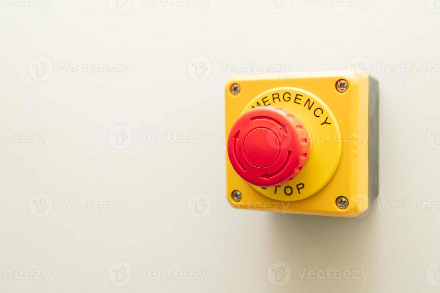 Stop Button and the Hand of Worker About to Press it. emergency stop button. Big Red emergency button or stop button for manual pressing photo