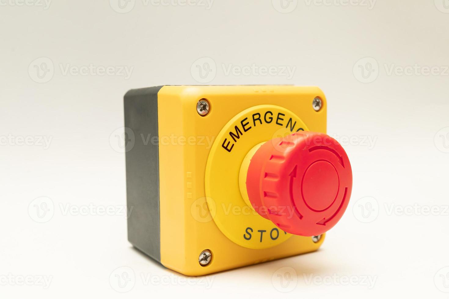 Stop Button and the Hand of Worker About to Press it. emergency stop button. Big Red emergency button or stop button for manual pressing. photo