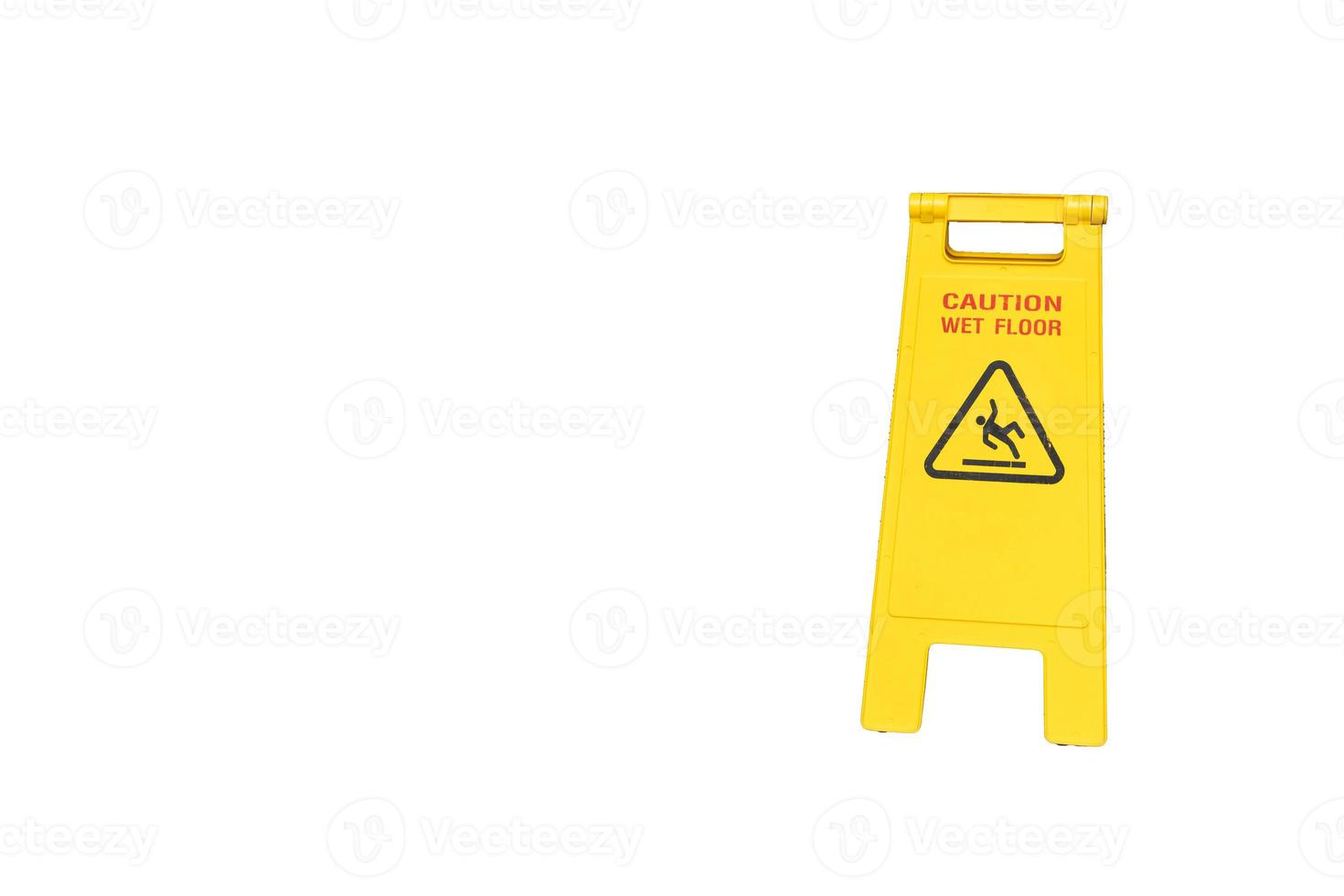 Yellow Caution slippery wet floor sign. Wet floor caution sign on walkway. Warning yellow plastic caution wet floor sign, isolated on white background photo