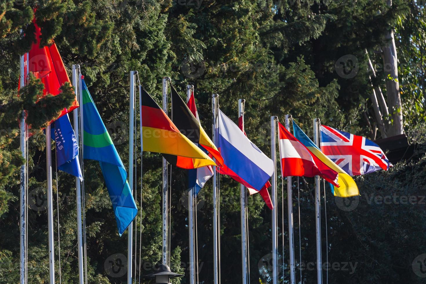 Close-up of national flags of different countries. Flags of Germany, Russia, Great Britain,  Italy, etc. photo