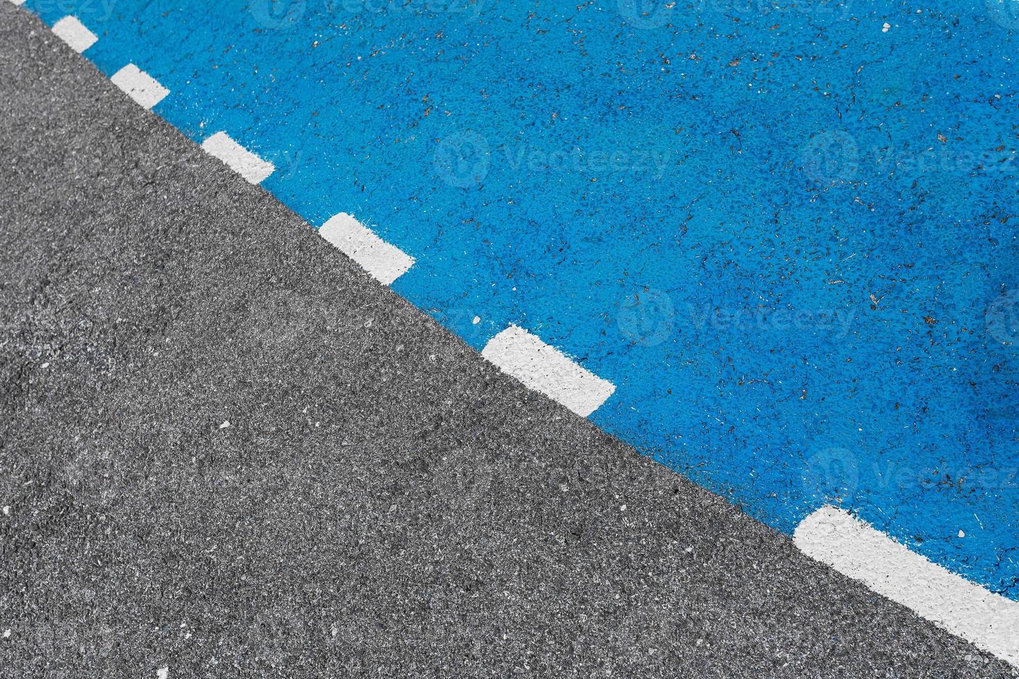 Close-up road, asphalt with intermittent markings photo