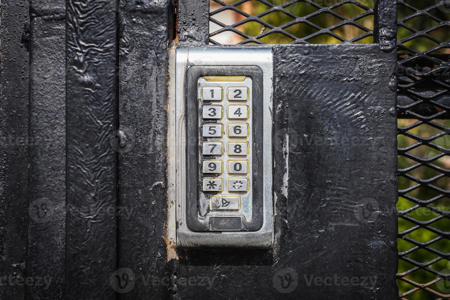 numeric keypad on concrete wall photo
