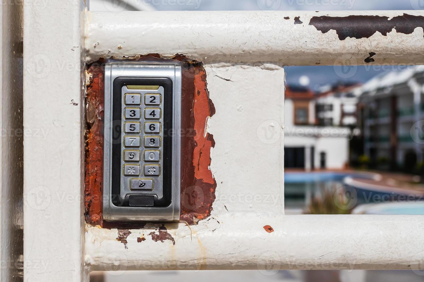 numeric keypad on concrete wall photo