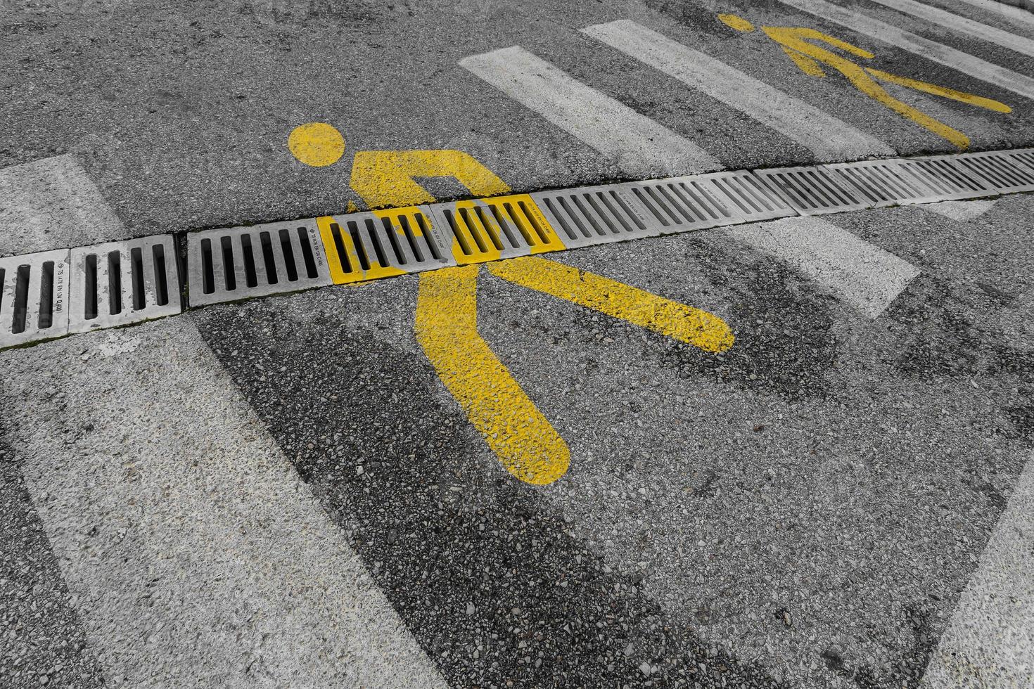 close-up of a pedestrian crossing with a yellow person icon photo