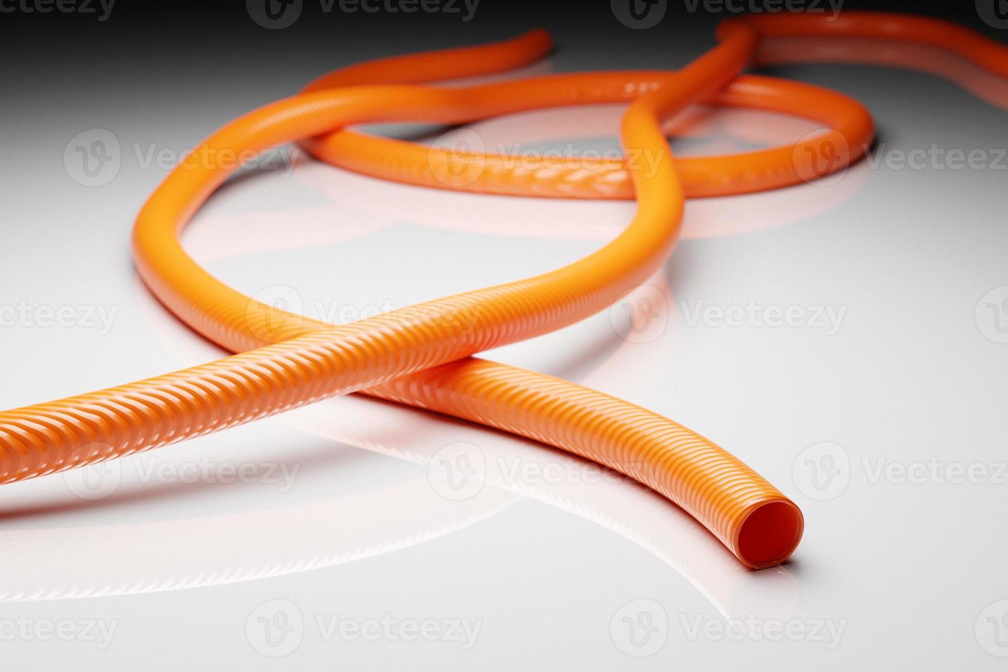 3d illustration orange hollow plastic hose isolated on white background photo