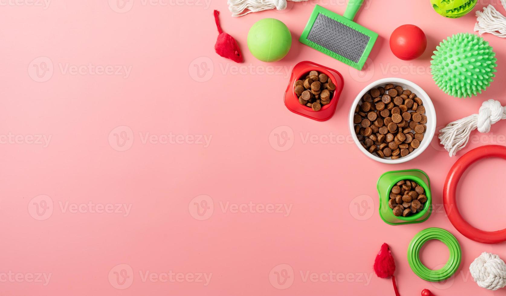 Pet care concept, various pet accessories and tools on pink background, flat lay photo