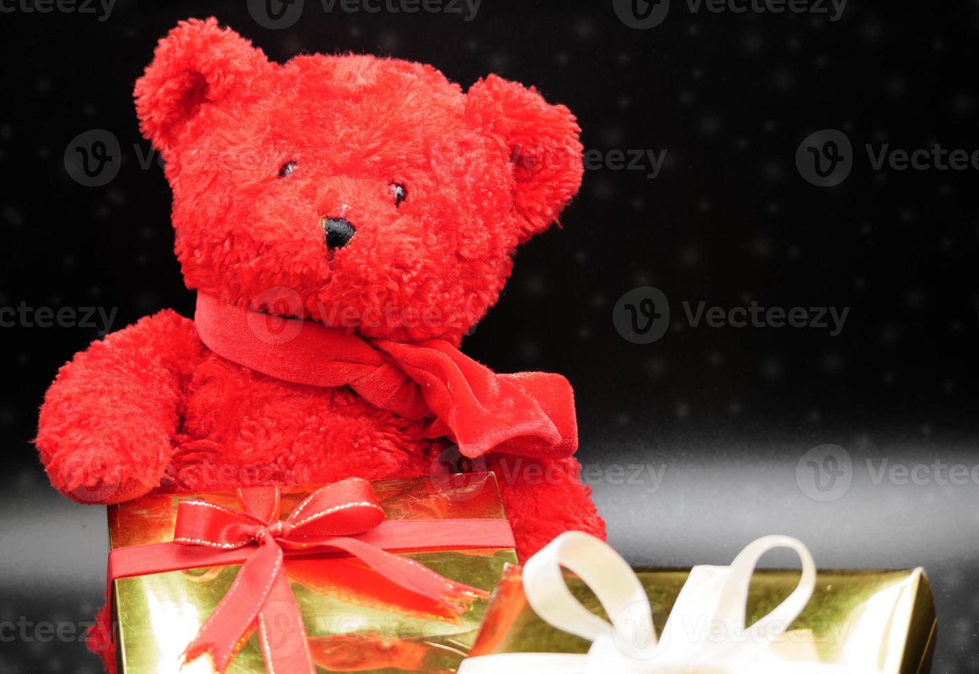 Teddy bear and gift boxes photo