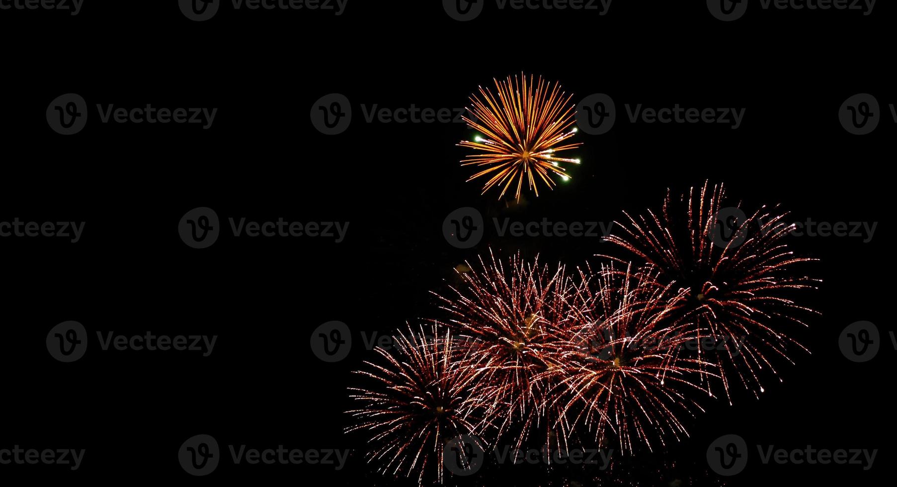 Glod and red fireworks sparkle full on the night sky photo