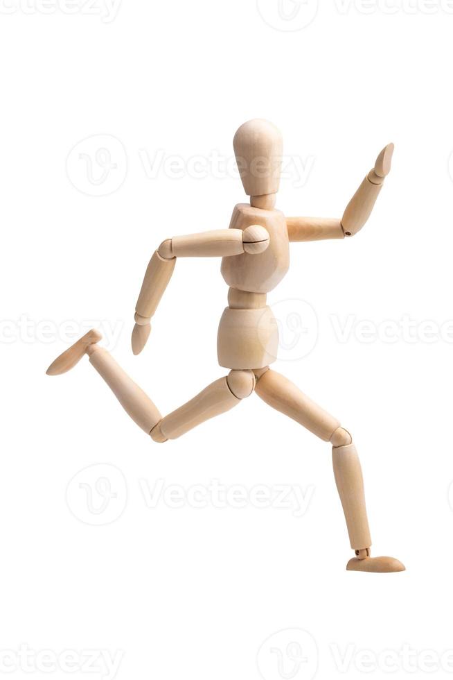 Wooden figure running isolated on white background photo