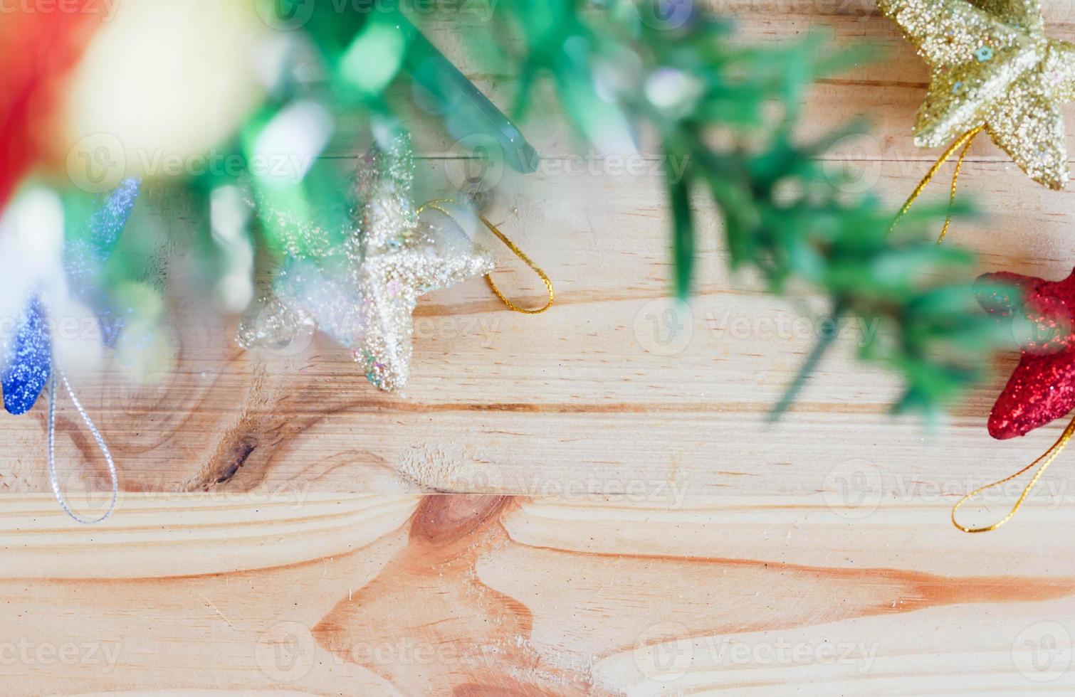 Christmas tree and star on the wooden background photo