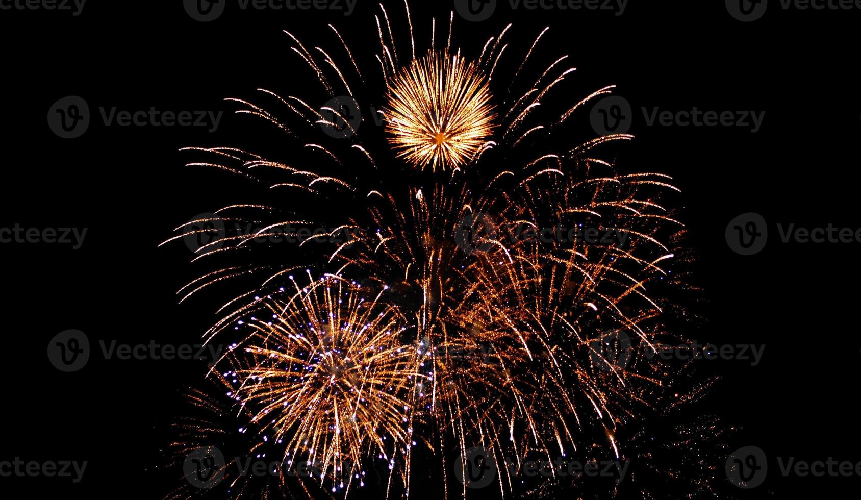 Glod fireworks sparkle full on the night sky photo