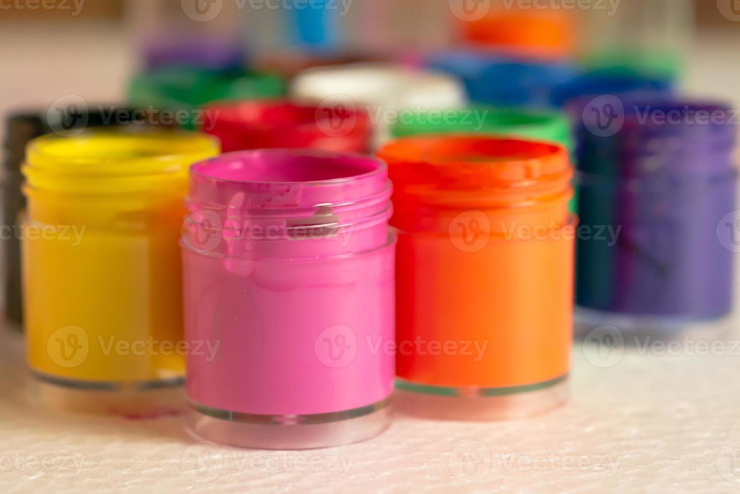 Color bottles placed on white foam pads photo