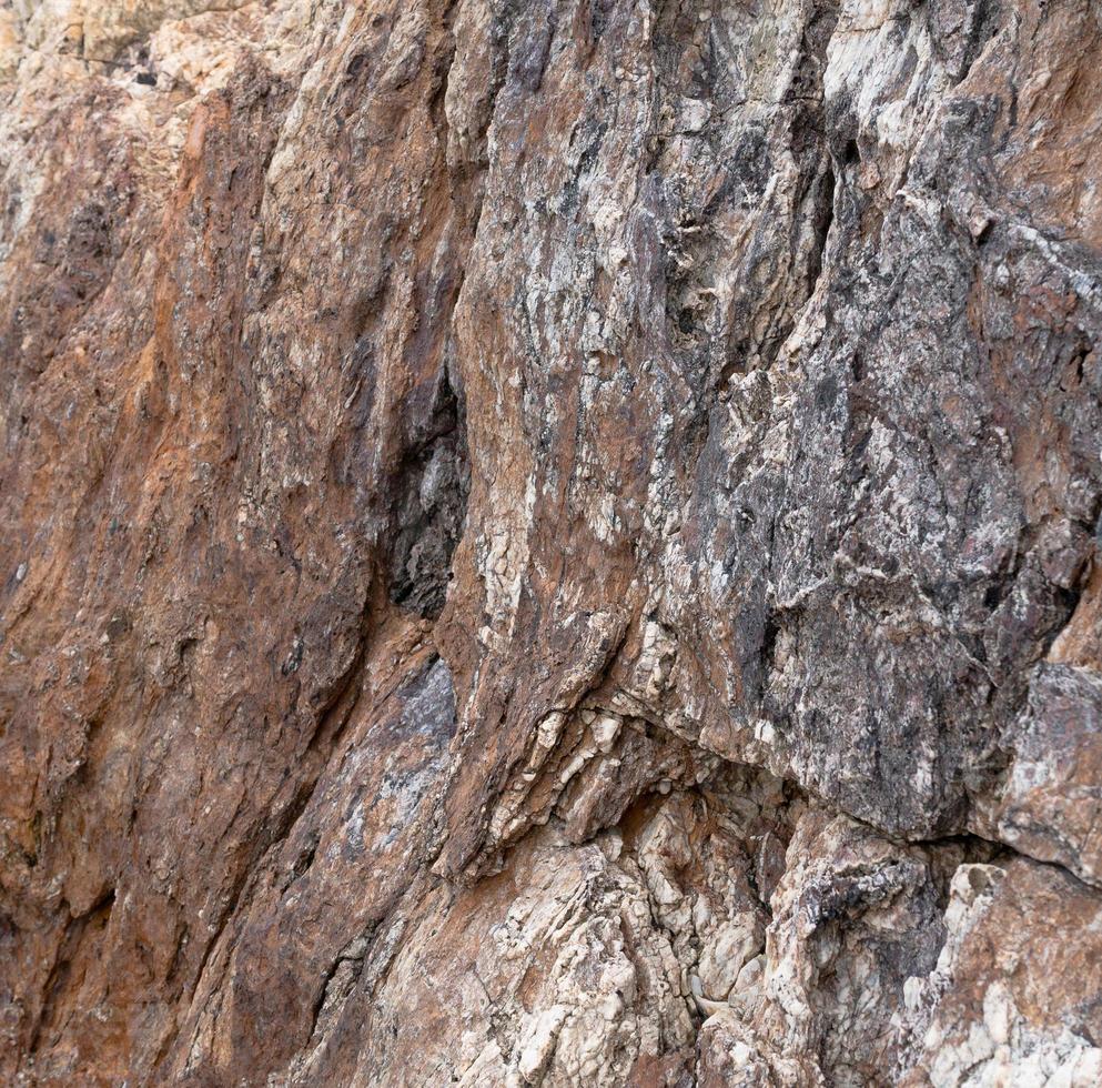 the stone surface of the cliff photo