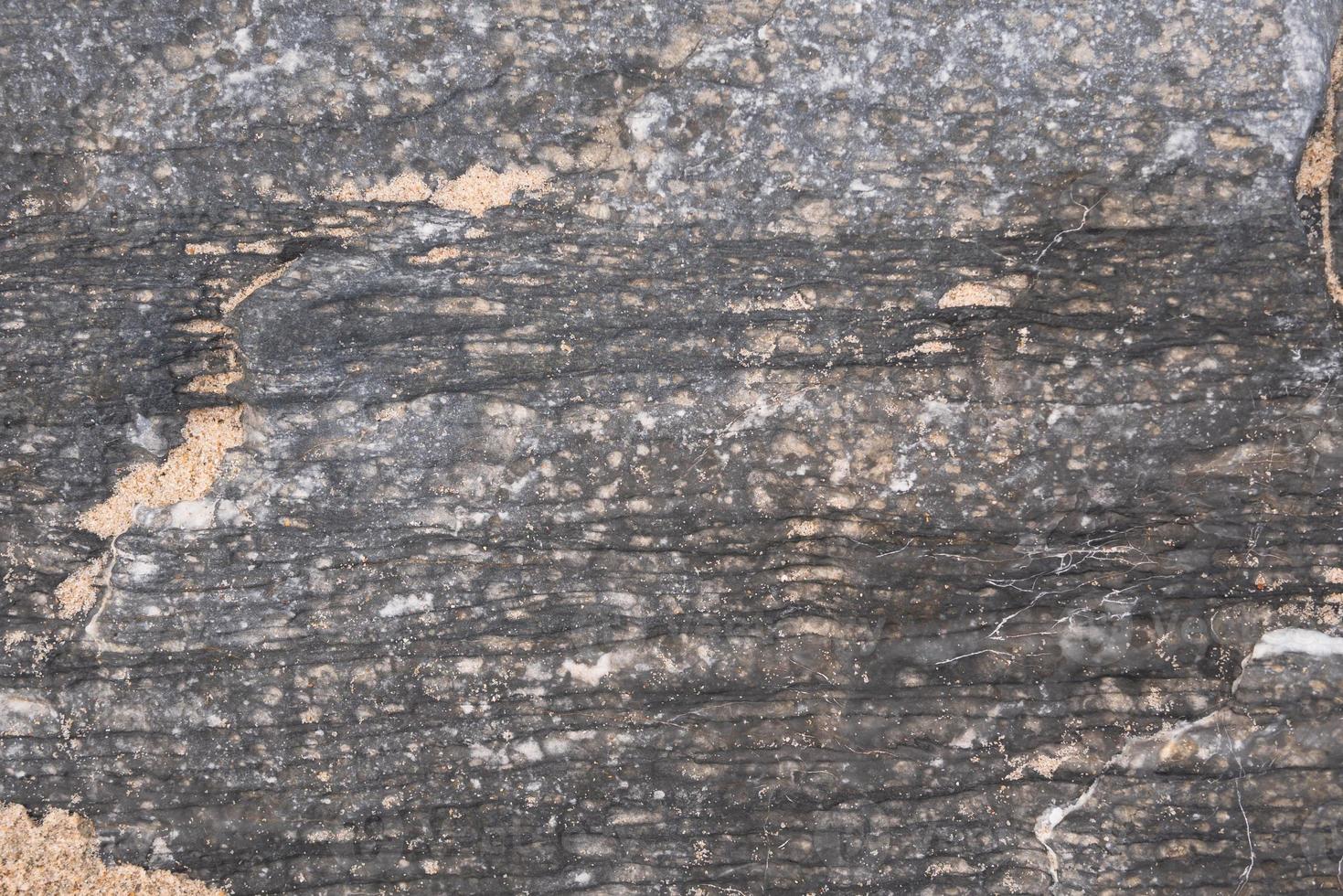 Abstract background and texture of stone with hit the sea water photo