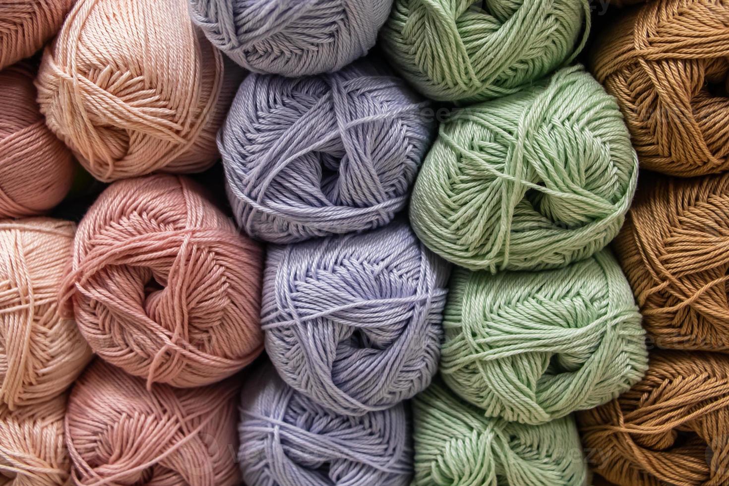 Background from multi-colored fluffy woolen threads for knitting. photo