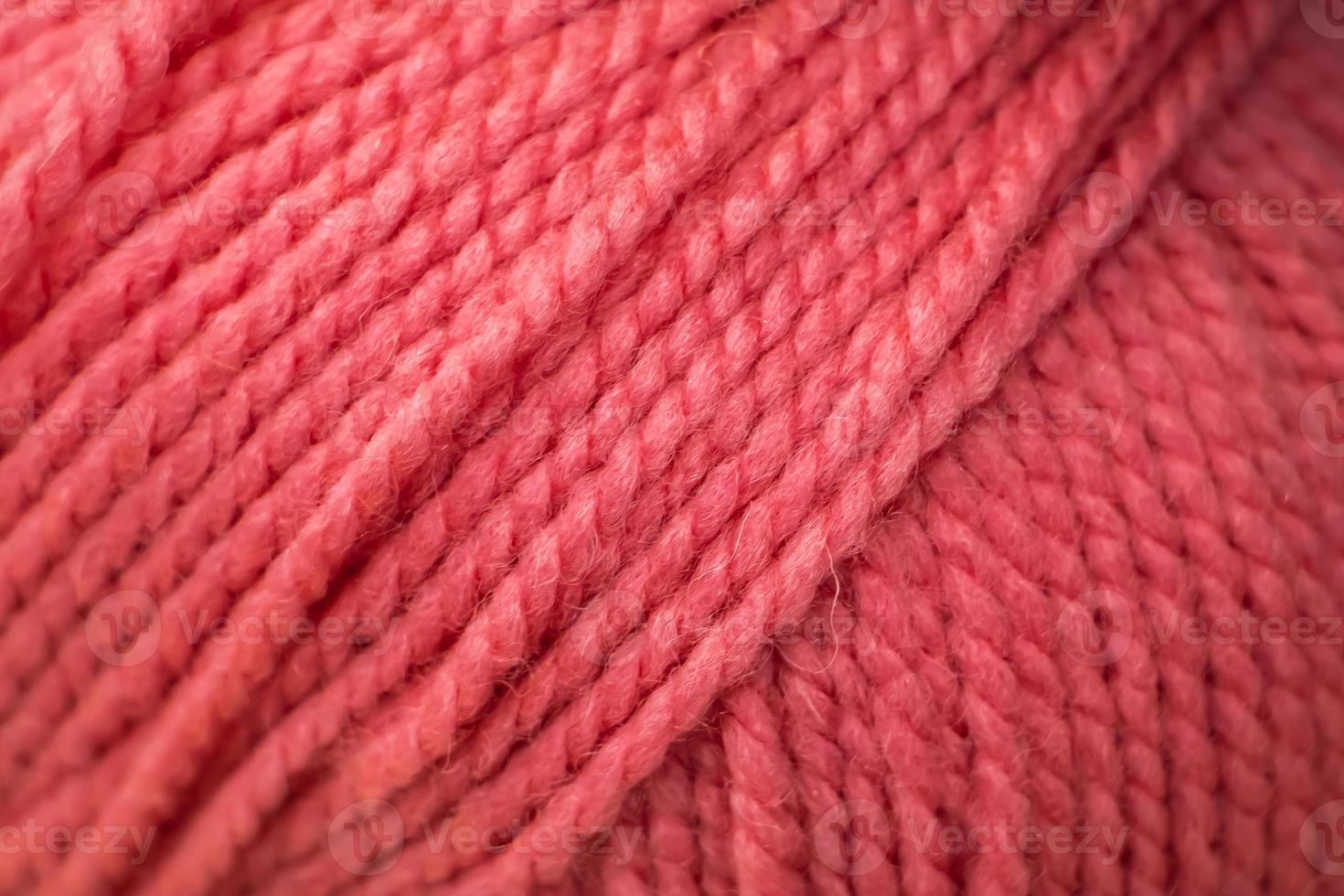 Texture of pink fluffy woolen threads for knitting. photo