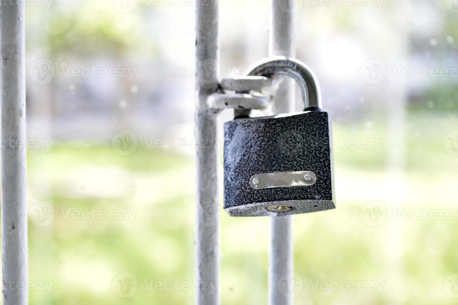 Iron lock on steel cages of doors and windows photo