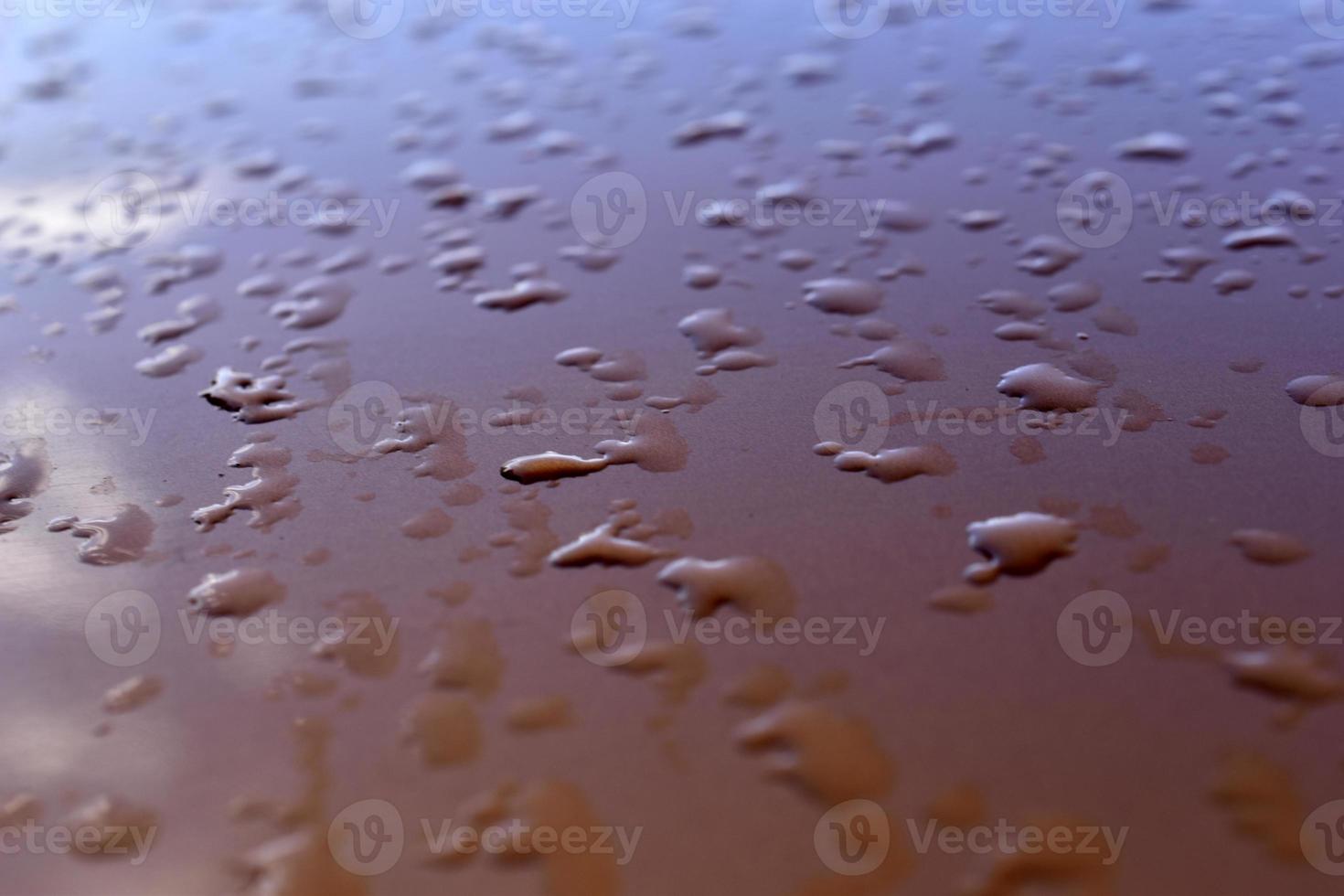 Water drops after rain on an orange background photo