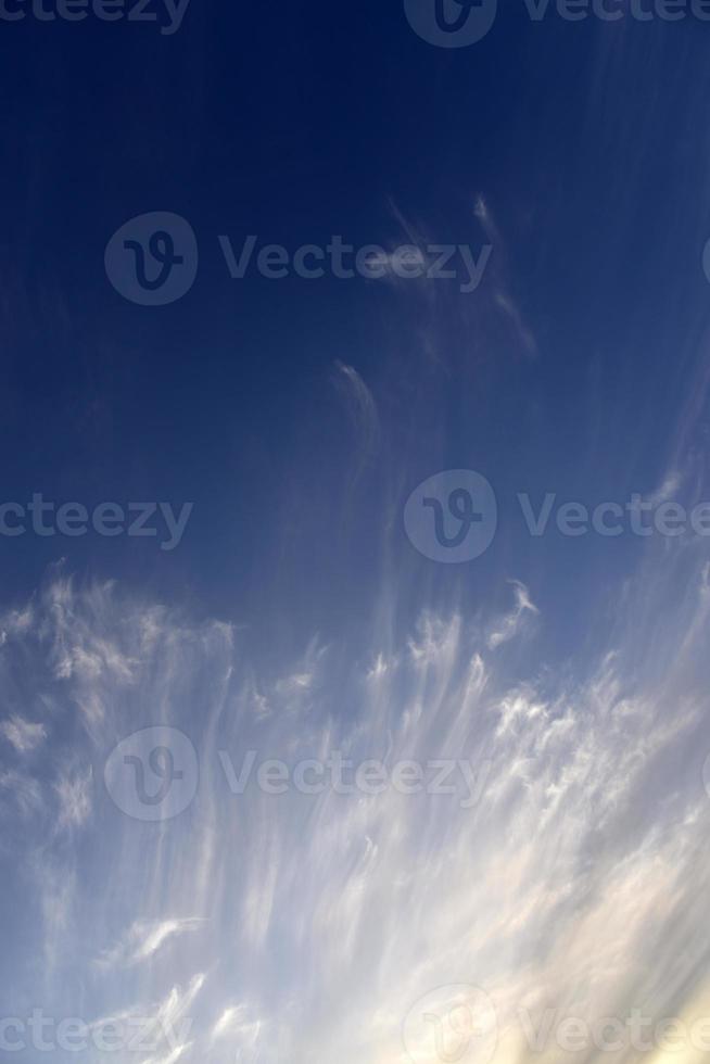 Evening sunset sky with blue and yellow clouds photo