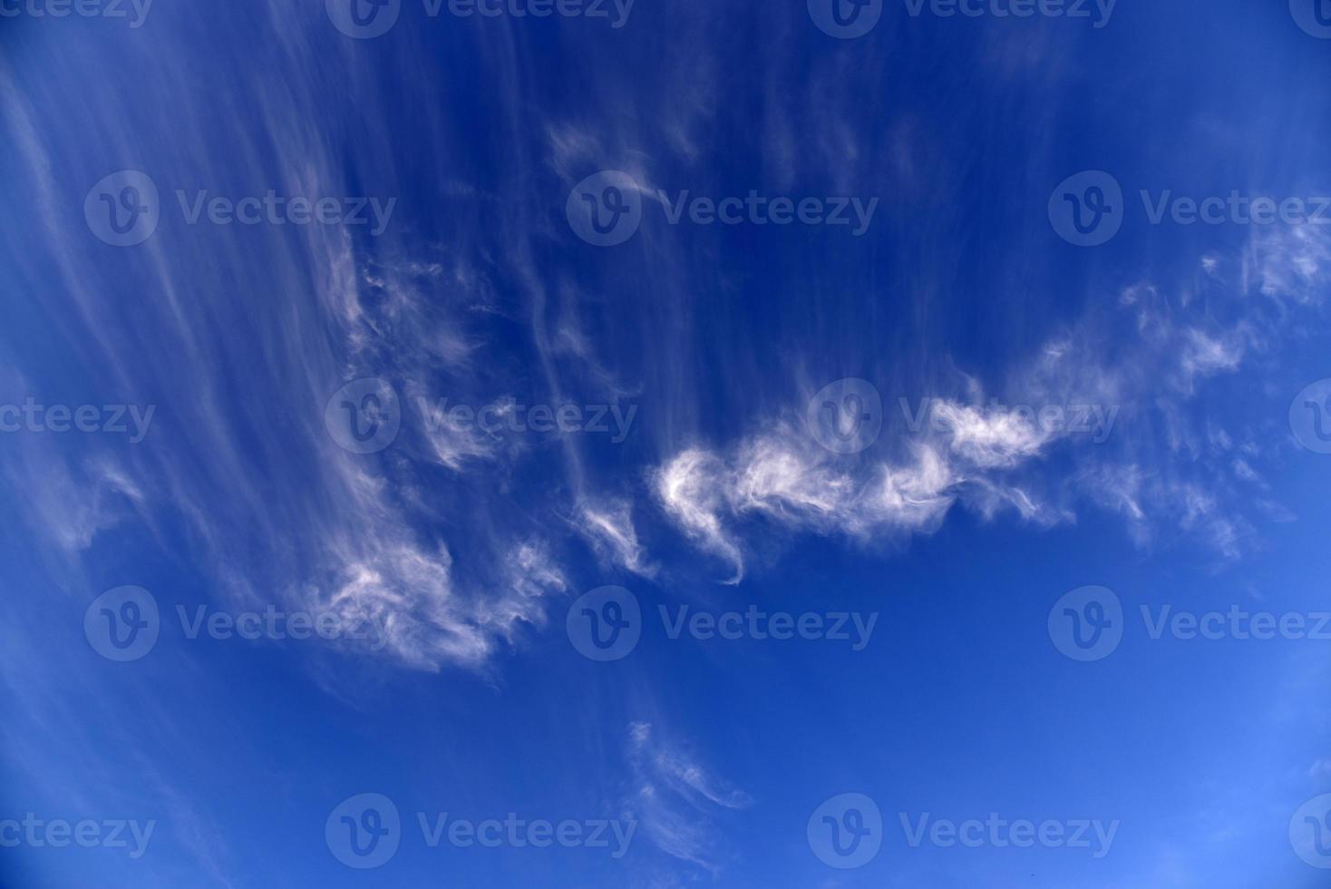 Evening sunset sky with blue and yellow clouds photo