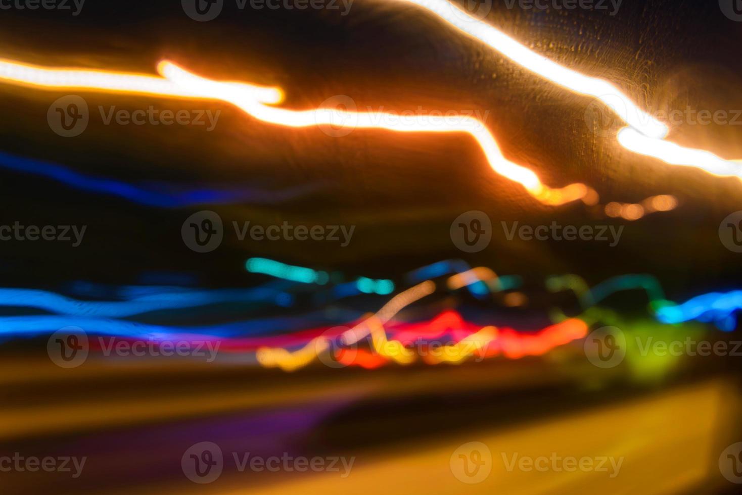 abstract motion lights of night traffic in the city photo