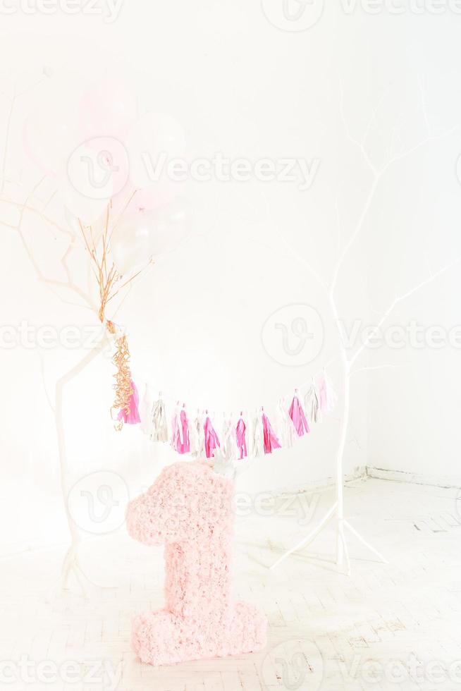 Scenery of numbers unit in flowers on a light background. Holiday one year, birthday girl baby. photo