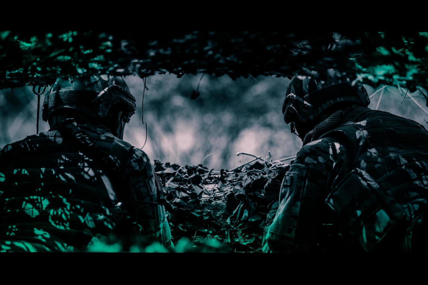 rear view of soldiers on the battlefield, Military Staging Base, Mission in Progress, In the forest at night photo