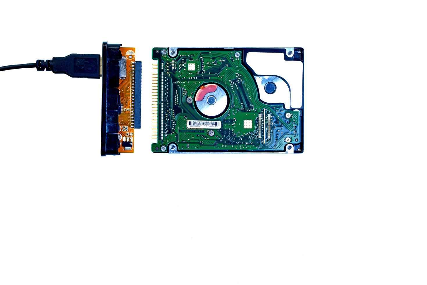 Hard disk IDE and USB adapter on a white background. photo