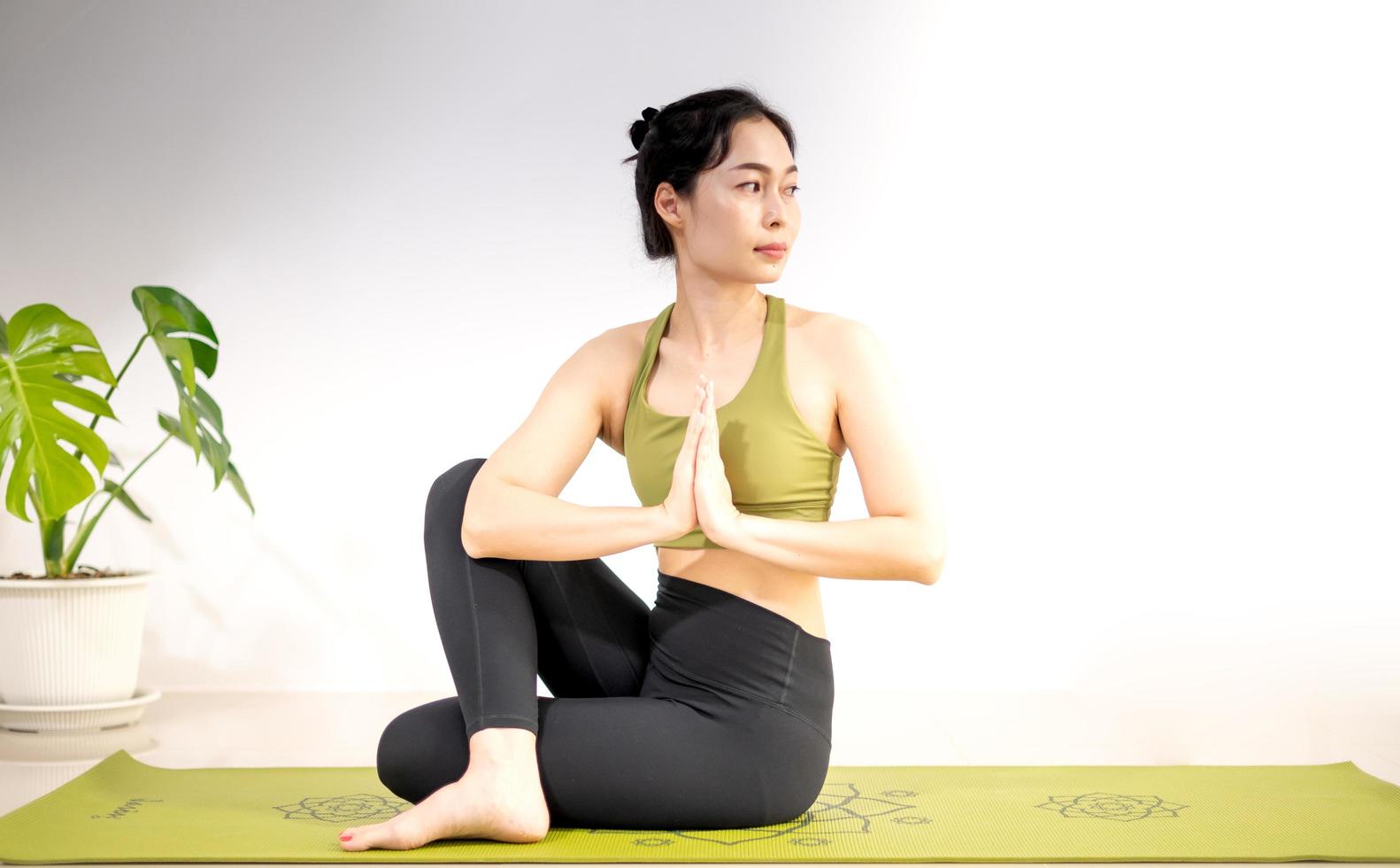 A Woman Doing a Yoga Exercise on a Yoga Mat · Free Stock Photo