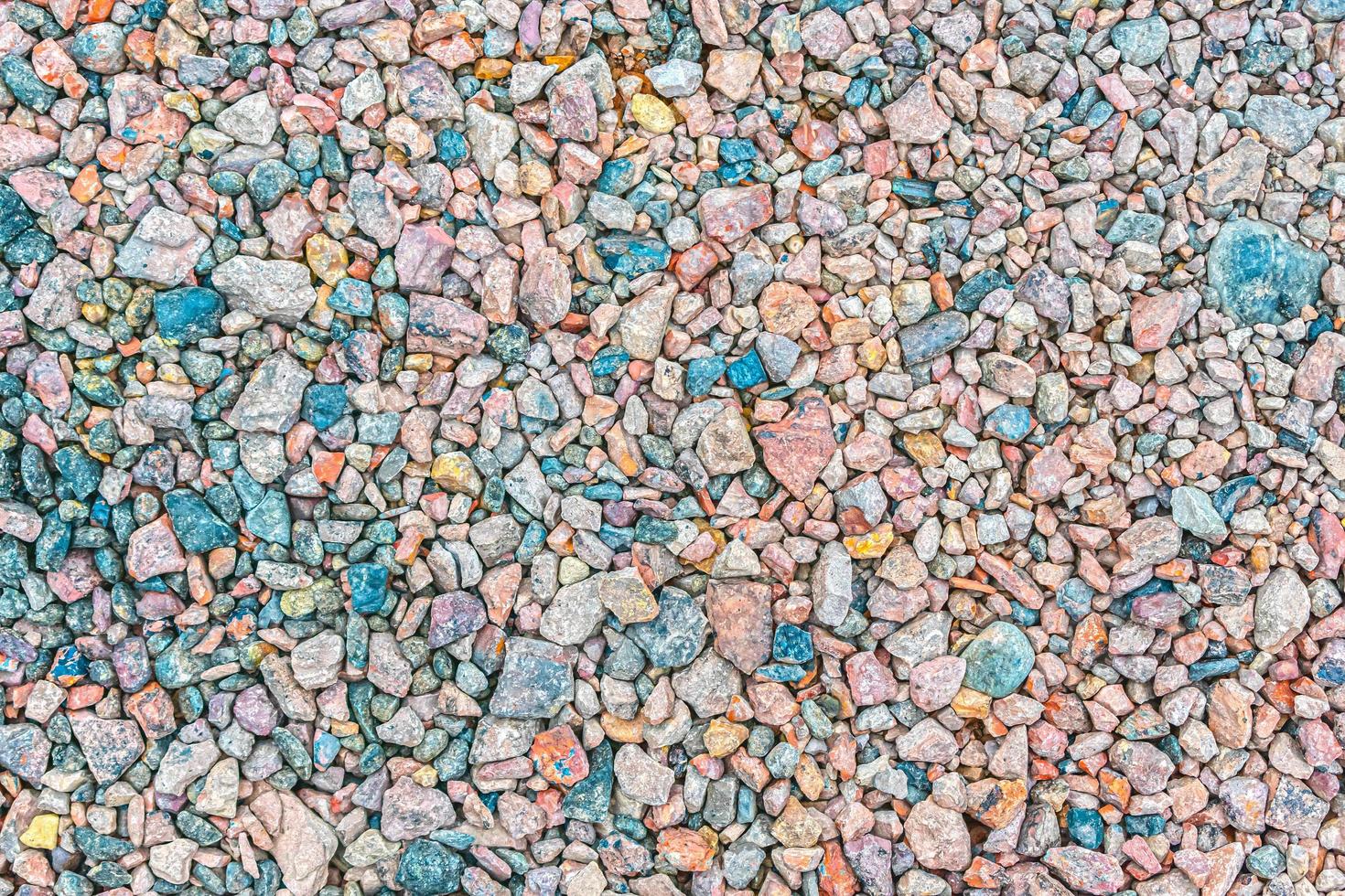 la textura de pequeña piedra triturada de diferentes colores foto