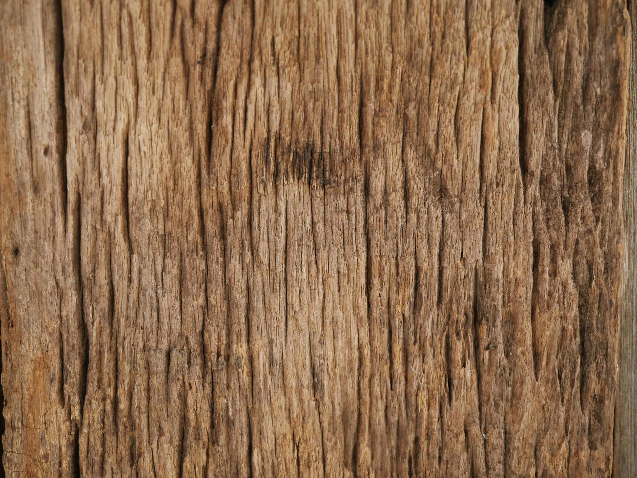 An old wooden plank table with a mottled surface and a pattern. photo