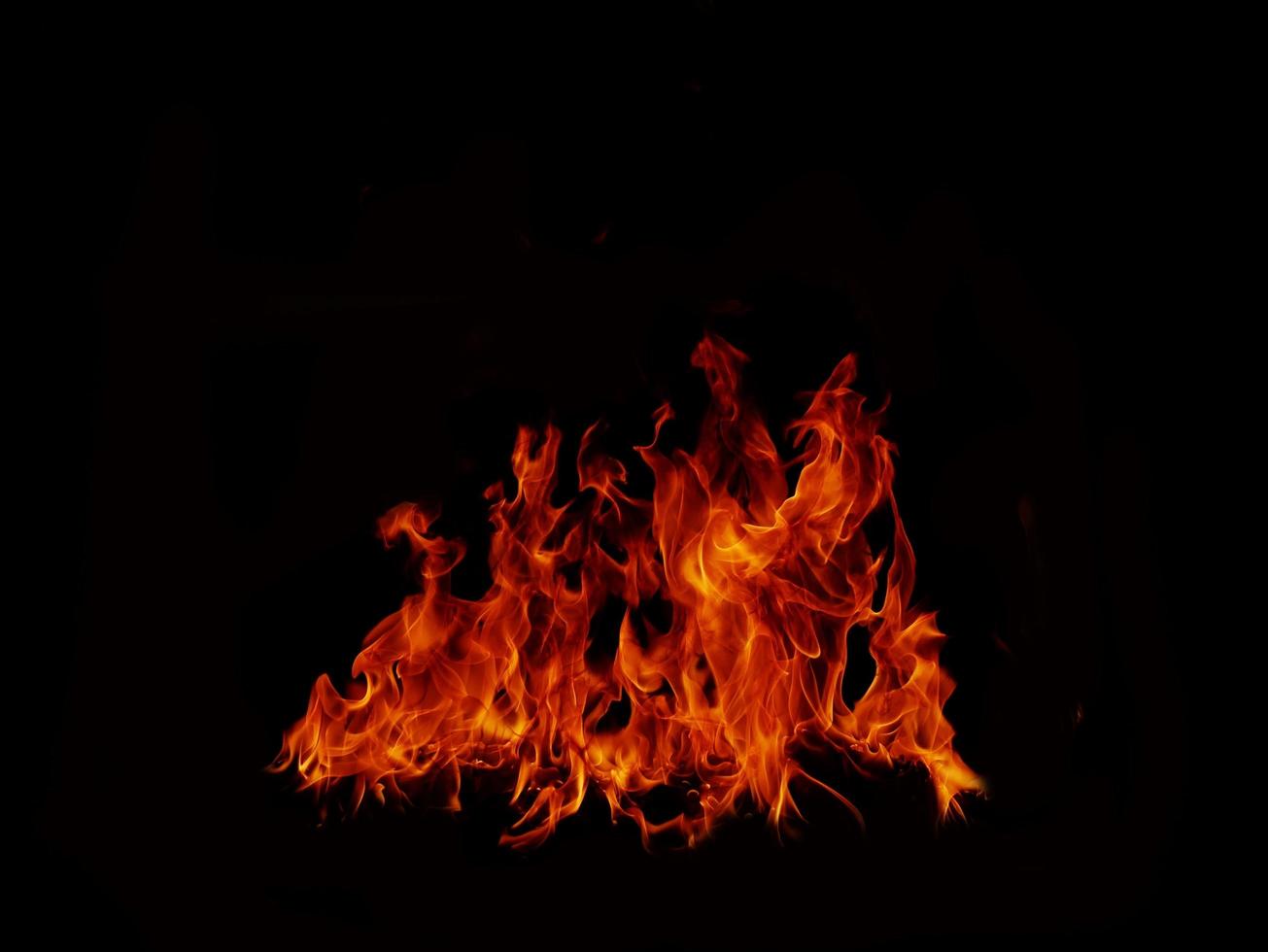 Flame Flame Texture For Strange Shape Fire Background Flame meat that is burned from the stove or from cooking. danger feeling abstract black background Suitable for banners or advertisements. photo