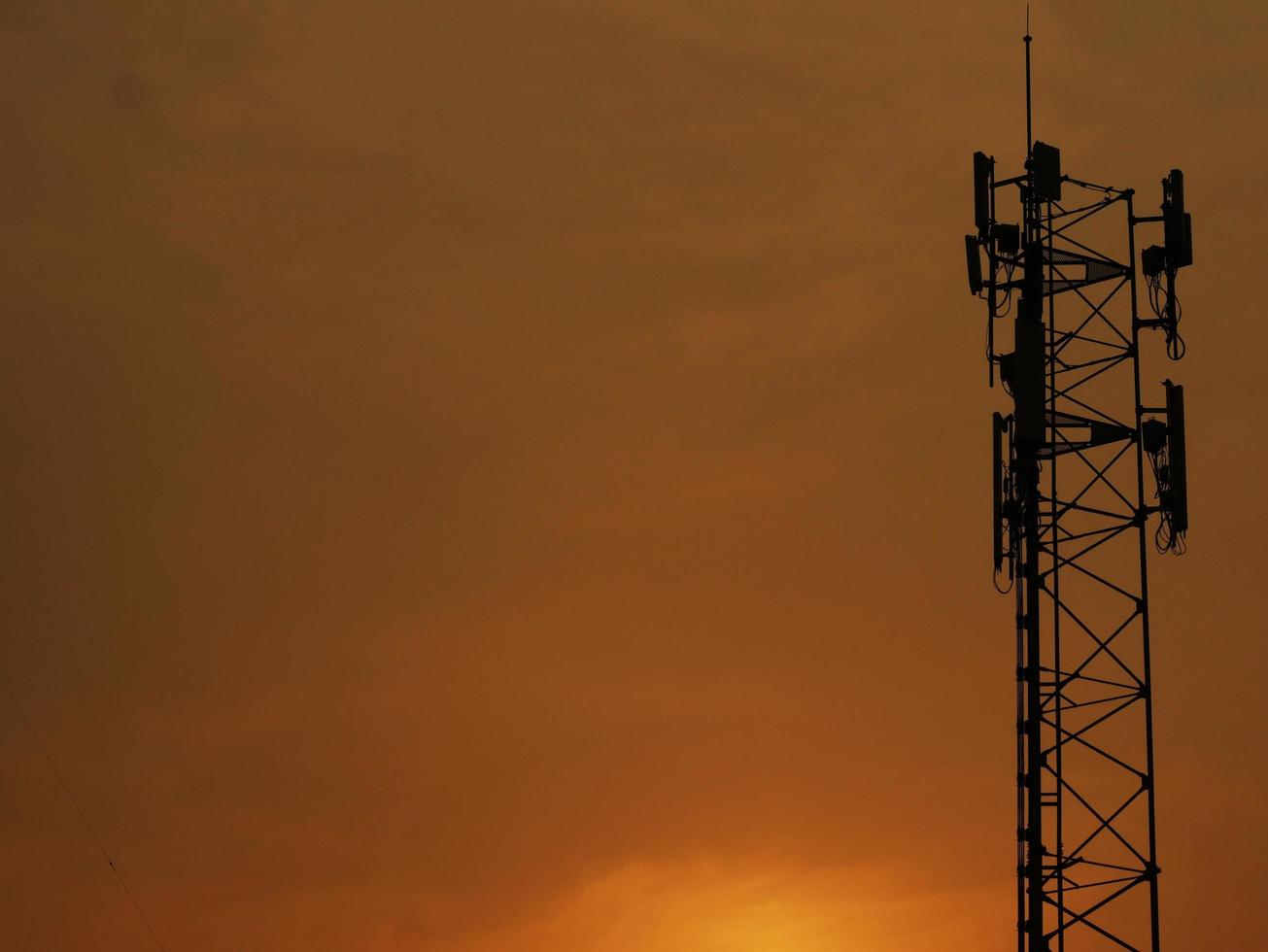 Telephone towers used to broadcast signals at dusk. photo