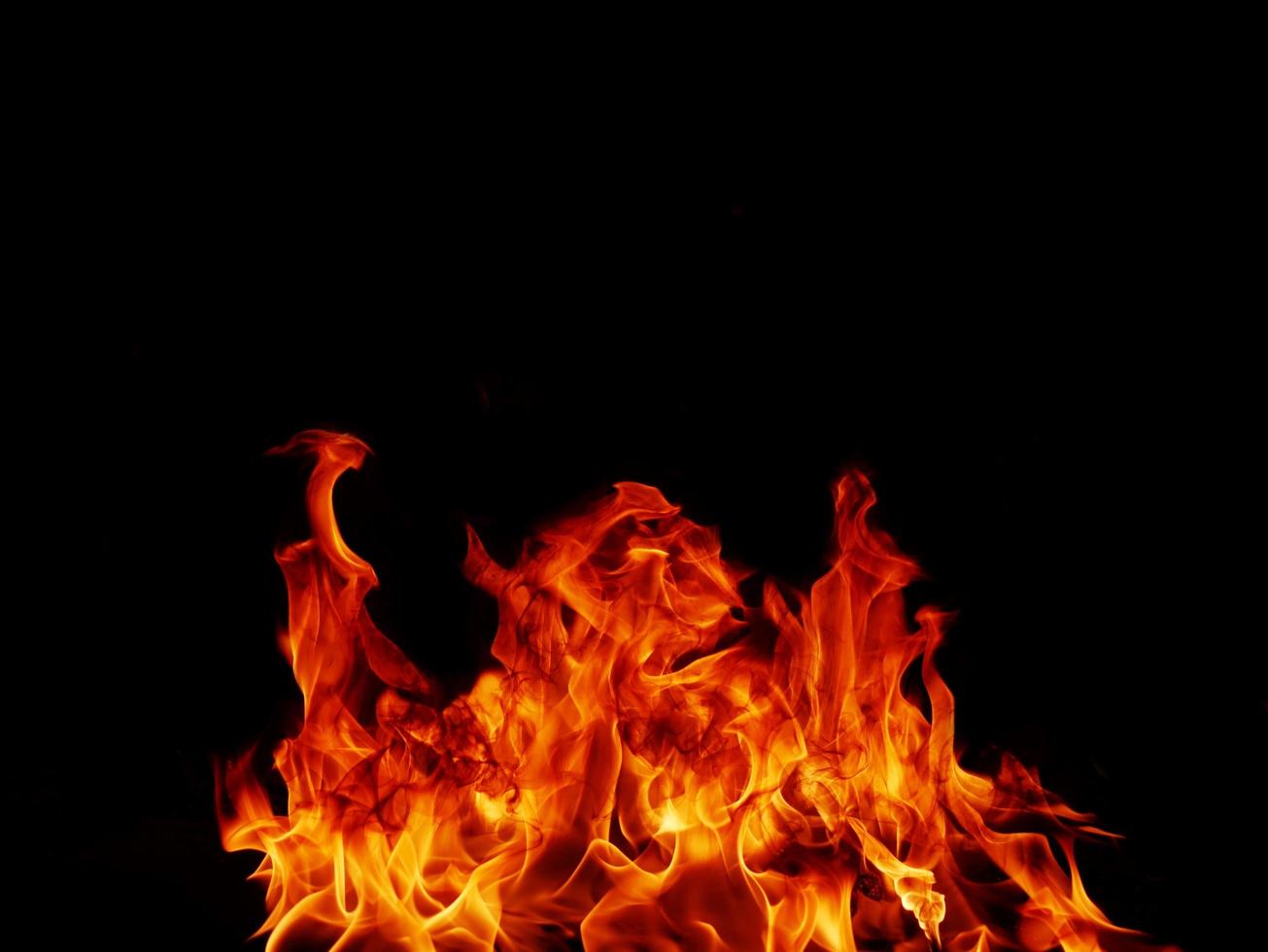 Flame meat that burns from a furnace or from cooking. dangerous feeling abstract black background .Suitable for banners or advertisements photo