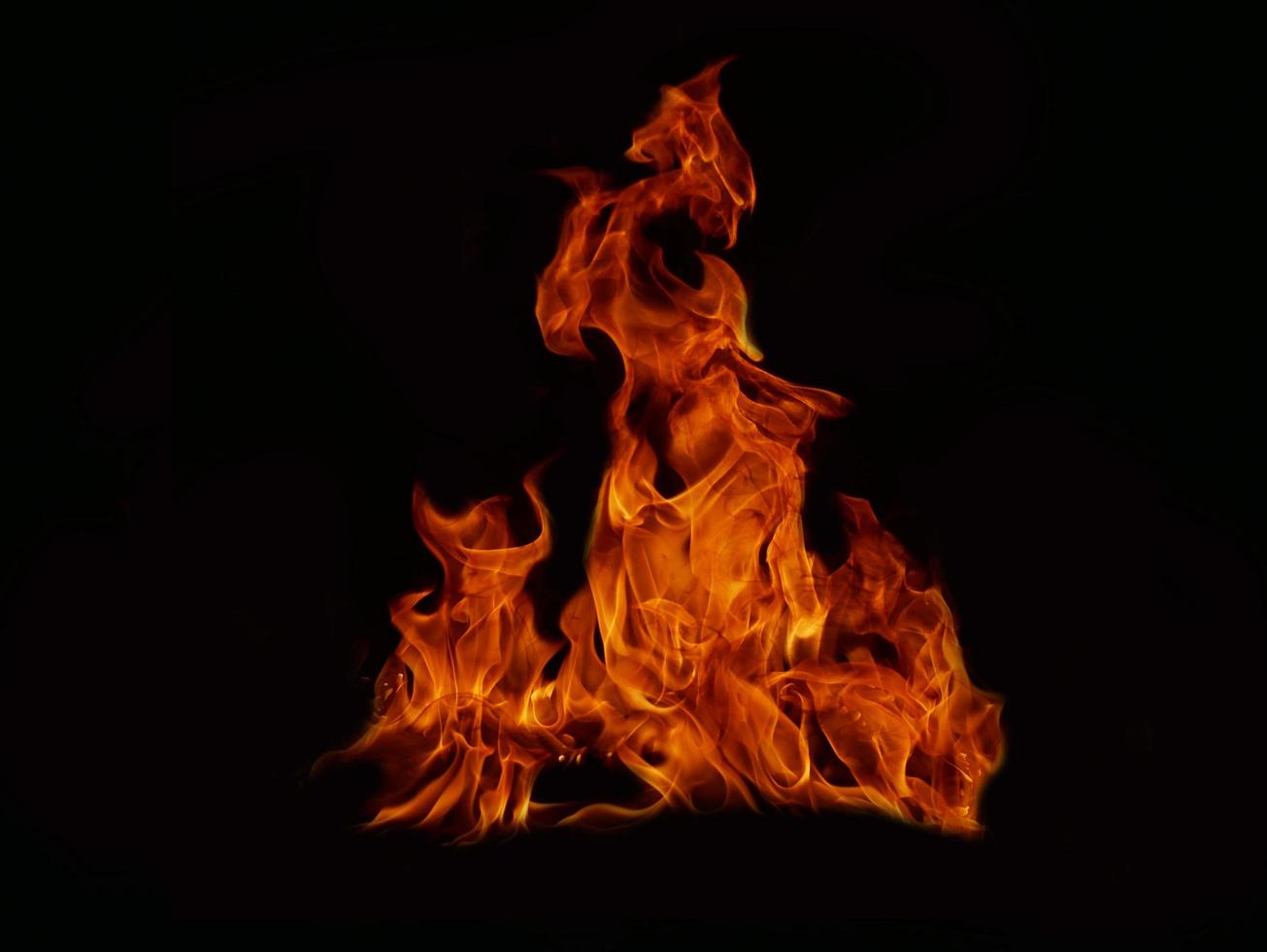 Flame Flame Texture For Strange Shape Fire Background Flame meat that is burned from the stove or from cooking. danger feeling abstract black background Suitable for banners or advertisements. photo