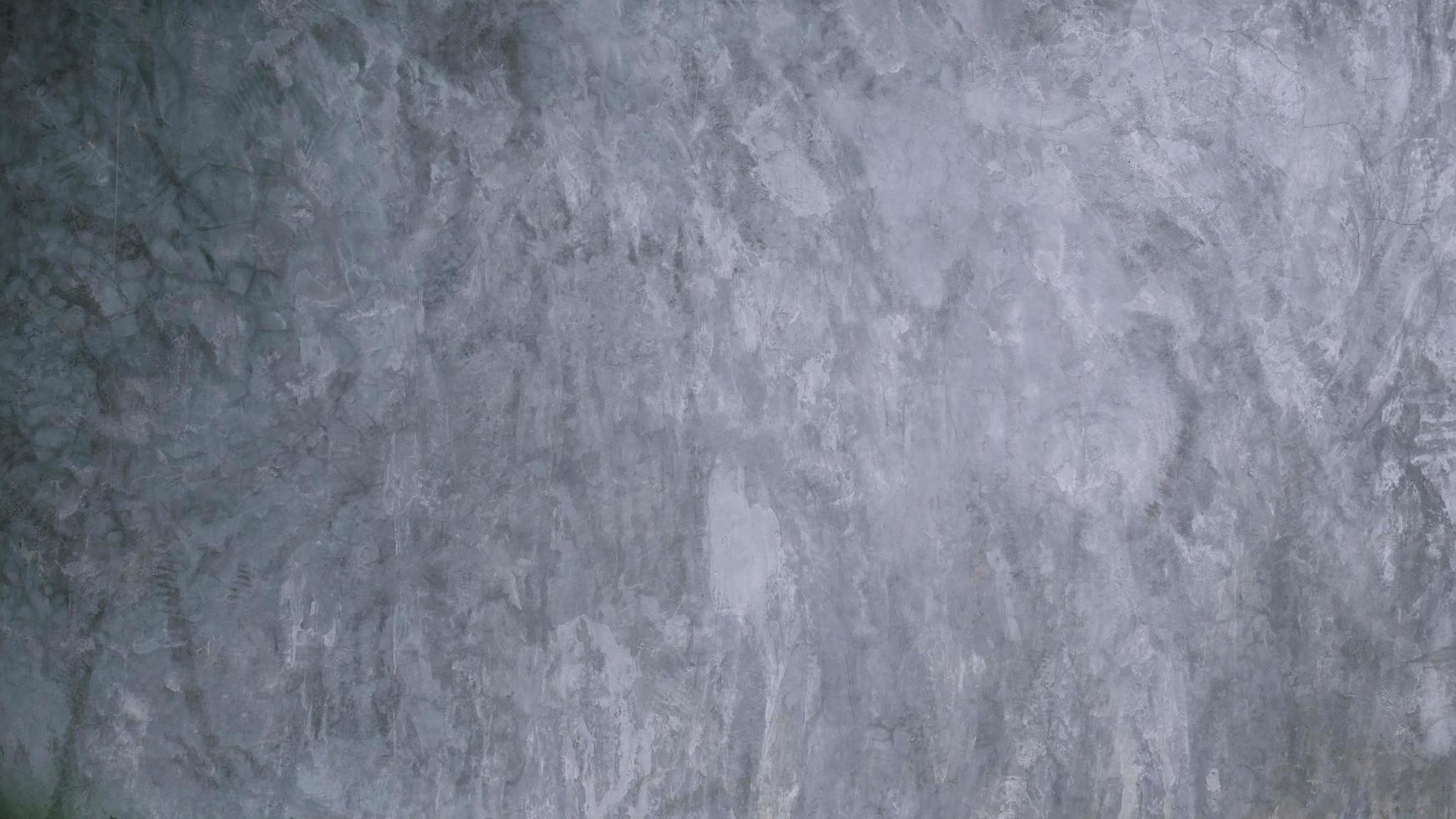 The old cement wall was weathered, the surface was scratched, the surface was scratched and damaged. For a mysterious retro-conservative background. photo