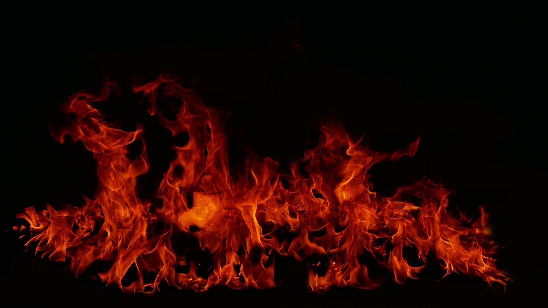 Flame Flame Texture For Strange Shape Fire Background Flame meat that is burned from the stove or from cooking. danger feeling abstract black background Suitable for banners or advertisements. photo