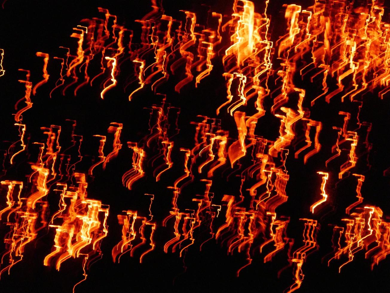 Fire flames with sparks on a black background.By shooting at high speed. photo