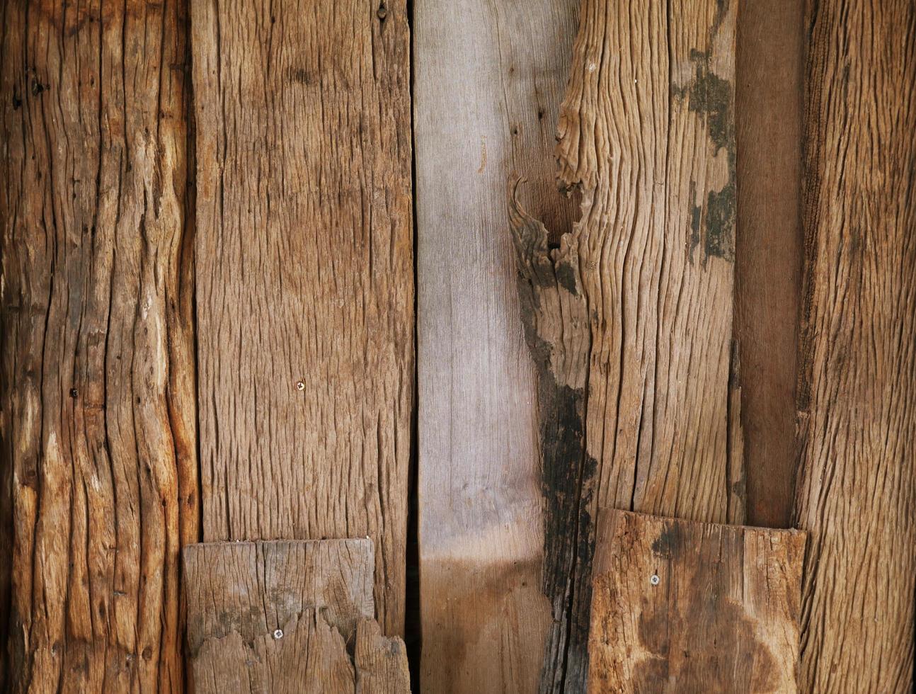 An old wooden plank table with a mottled surface and a pattern. photo