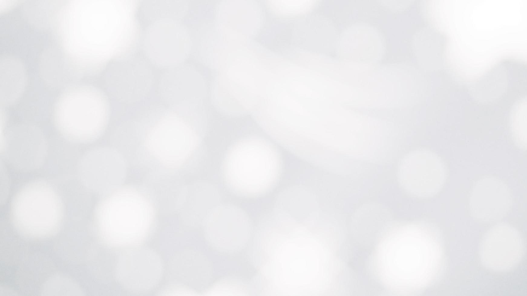 The illuminated white bokeh image can be used as a background illustration or add text. photo