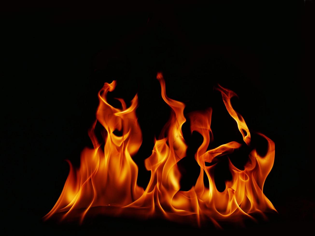 Flame Flame Texture For Strange Shape Fire Background Flame meat that is burned from the stove or from cooking. danger feeling abstract black background Suitable for banners or advertisements. photo