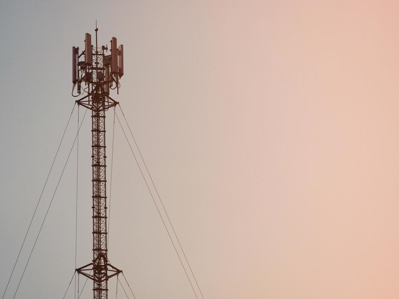 Telephone towers used to broadcast signals at dusk. photo