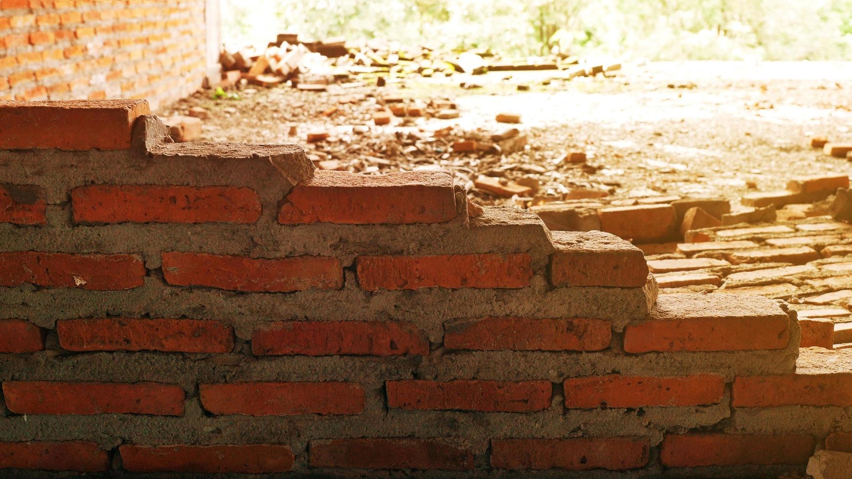 Unconventional building site The masonry was neglected, irresponsible, not progressing, only half finished. Some parts, the walls had rough surfaces. photo