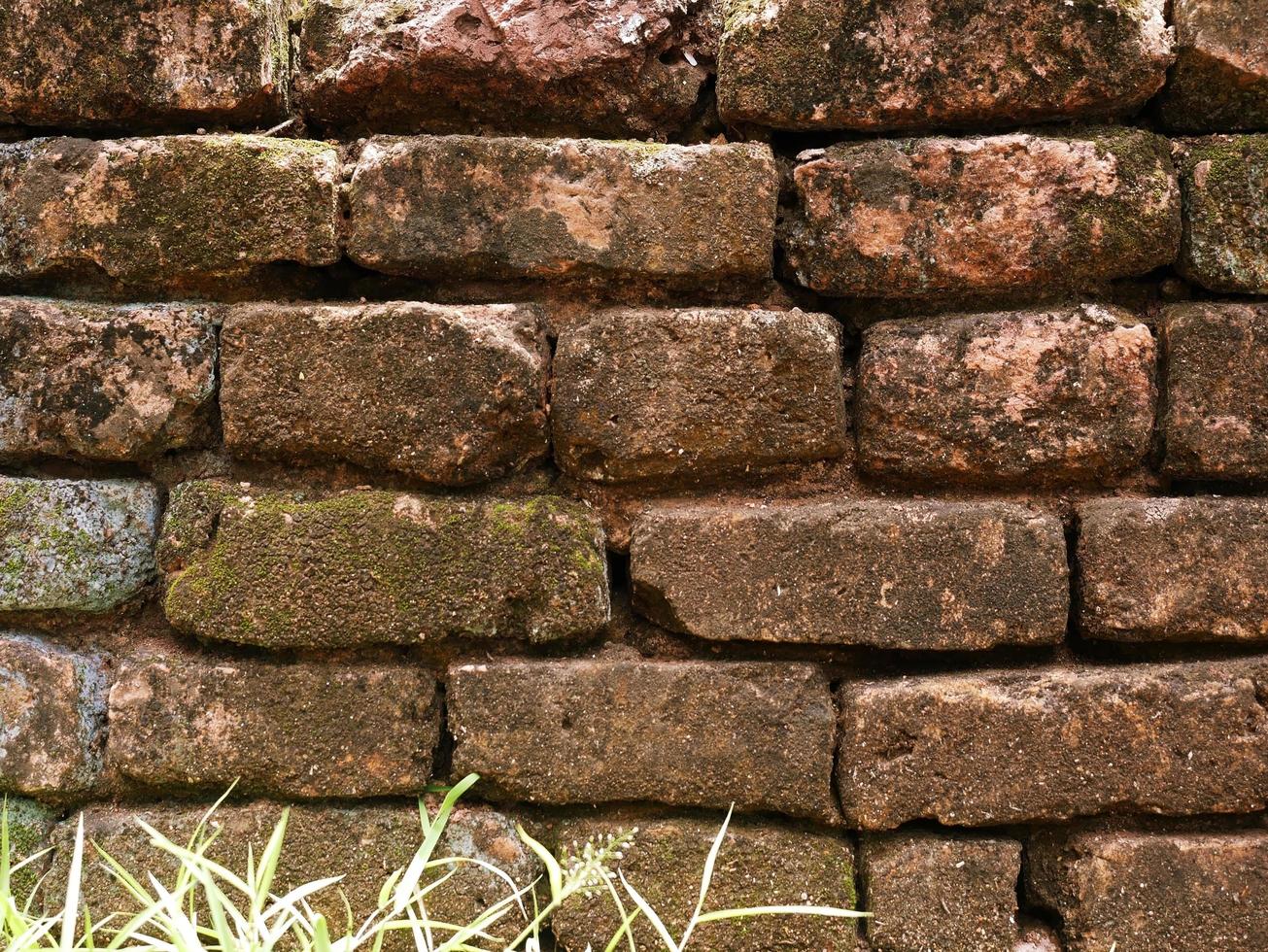 The old cement wall was weathered, the surface was scratched, the surface was scratched and damaged. For a mysterious retro-conservative background. photo