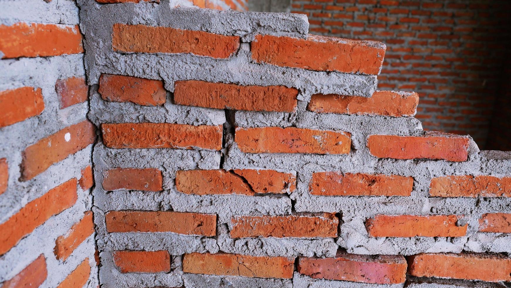 Unconventional building site The masonry was neglected, irresponsible, not progressing, only half finished. Some parts, the walls had rough surfaces. photo